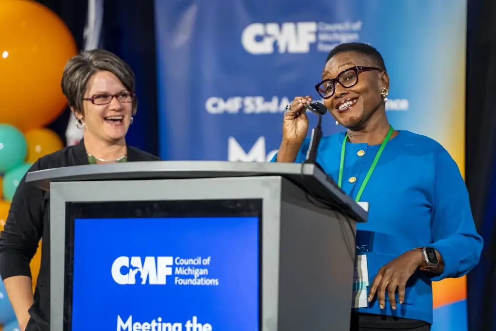 Dr. Grace Lubwama welcomes CMF members to the Annual Conference in Kalamazoo.