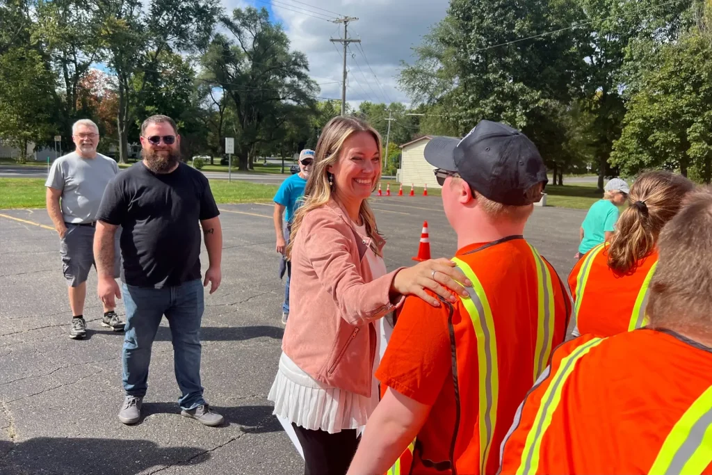 Cherie Good, head of corporate giving at Dawn Foods, assisting with fresh food distribution with David’s Promise participants, a program for adults with disabilities that focuses on personal growth, skill development, and community involvement.